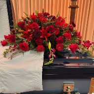 Pretty in red casket spray