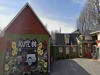 Webb City Florist storefront with Route 66 floral murals and welcoming entrance