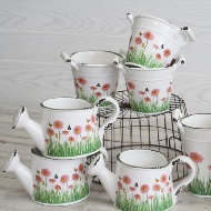 ceramic flower pot with flower on it .