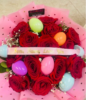#1 Easter Bouquet  12 red roses with baby breath with plastic easter eggs