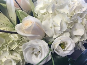 125 All white loose cut flower  bouquet  wrapped in cellophane 
