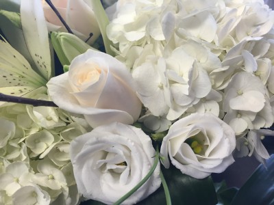 125 All white loose cut flower  bouquet  wrapped in cellophane 