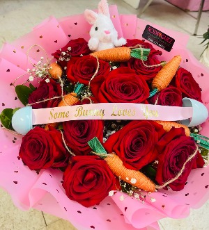 #2 Easter Bouquet 12 red roses with baby breath with added accesories