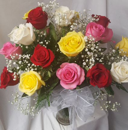 21 mixed colored roses arranged in a vase..(R)  with baby breath! POPULAR FOR 21ST BIRTHDAY!!
