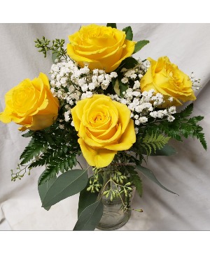 "SUNRISE"...4 Yellow Roses with seasonal ..(R) filler arranged in a vase.