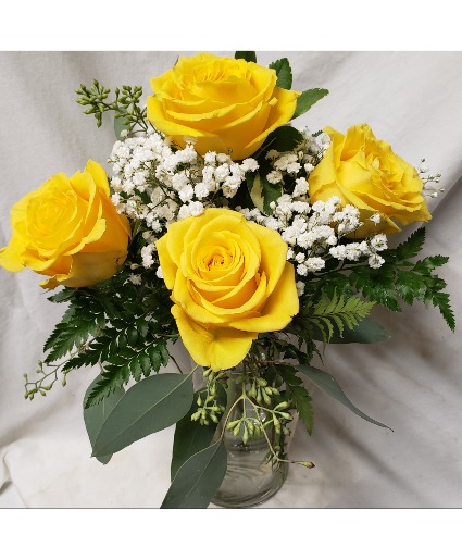 "SUNRISE"...4 Yellow Roses with seasonal ..(R) filler arranged in a vase.