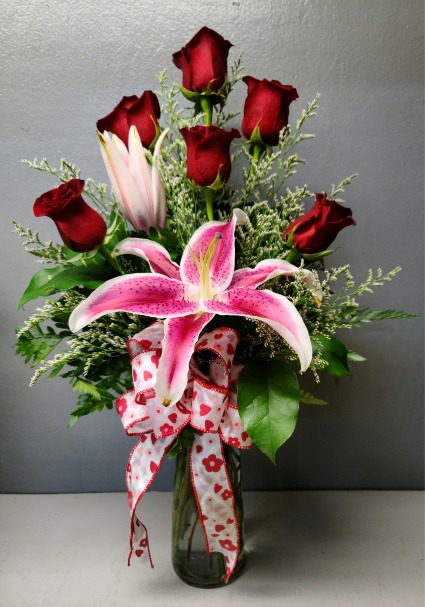 6 red roses and a starfighter lily Fresh Flower Arrangement 