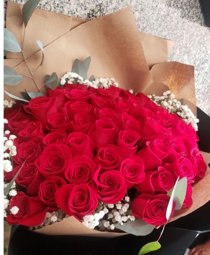 60 red roses black paper wrapped 