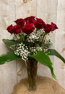 A Dozen Red Roses  in a fluted vase