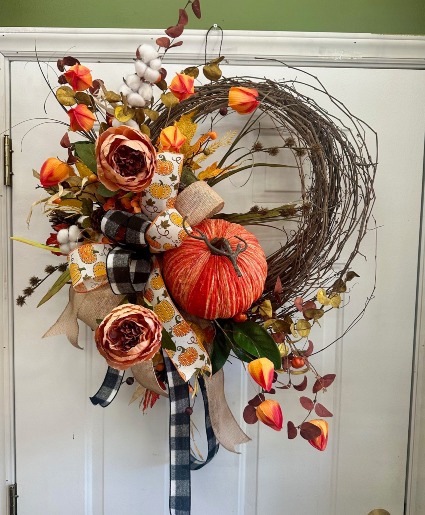 A large pumpkin  SILK DOOR WREATH