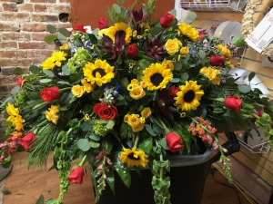 Array of Sunlight Sympathy Casket Spray