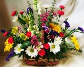 EUROPEAN GARDEN TRIBUTE   (S) Seasonal mixed bright flowers in wicker basket