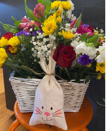 Basket & easter chocolate candies Basket of mix colorful seasonal flowers