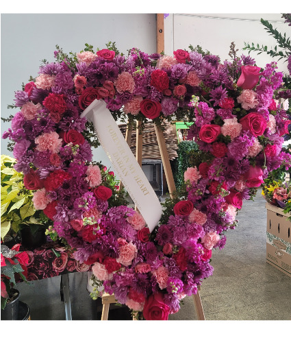 beautiful mixed heart funeral on an easel
