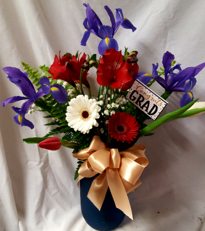 Talawanda Graduation colors! Red, white (G) and blue flowers arranged in a vase.