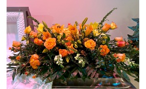 Blooming with Love Casket Spray