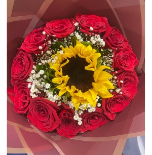 Bouquet  12 red roses with a sunflower in the middle, and baby breath