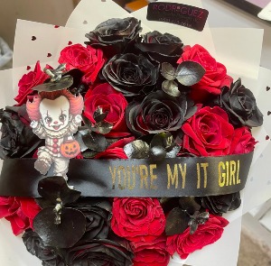 Bouquet I.T.  24 roses with added accesories *desired ribbon message may be added under special instructions