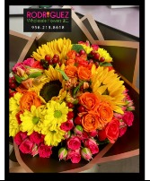 Bouquet Includes a variety of flowers; roses, sunflowers, and more
