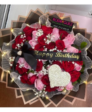 Bouquet of 50 roses with ribboon/heart 50 roses pink and red with baby breath, and a baby breath heart. 