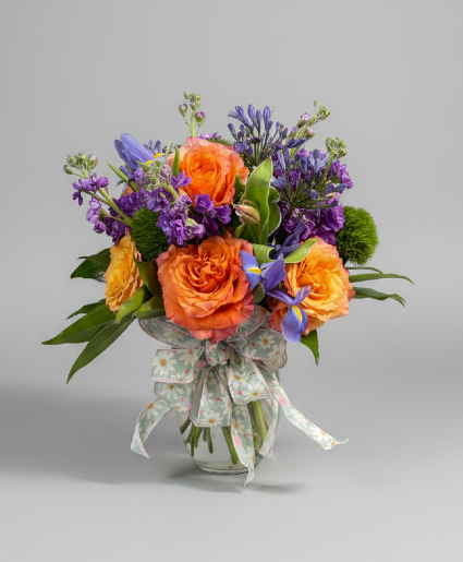 Bright and Cheery Vased arrangement using a mix of bright colored blooms
