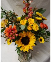 Bright fall vase arrangement... (F) seasonal flowers arranged in vase.
