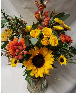 Bright fall vase arrangement... (F) seasonal flowers arranged in vase.