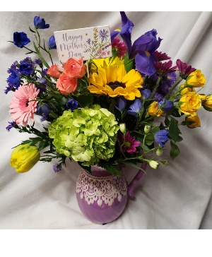 CERAMIC PITCHER WITH LACE DETAIL (MD) Arranged with bright seasonal flowers and included a Happy Mothers Day Pic!