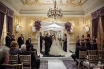 Chuppah with purple flowers Ceremony  