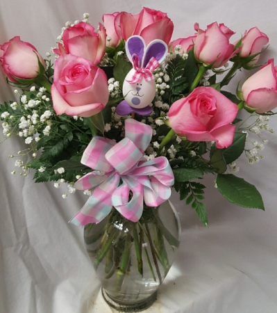 Dozen Pink Roses arranged in a Vase (HE) with a bow And bunny pic included.