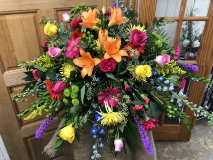 Colorful Condolences  Casket Spray