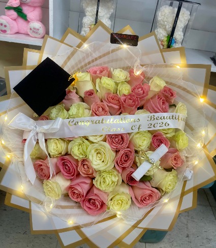 Congrats Beautiful Bouquet 50 pink and white roses with added accessories 