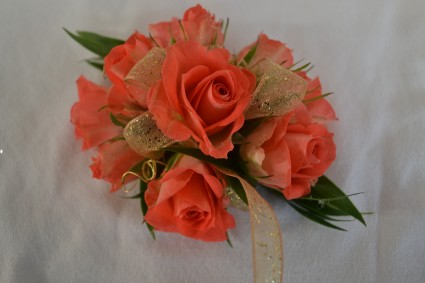 coral blossoms wrist corsage