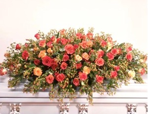 Coral full size casket spray 