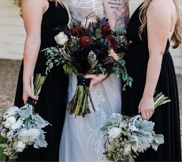Crimson & Cream Bold blooms with a touch of mystery — the perfect blend of dark romance and striking beauty. in Canon City, CO | TOUCH OF LOVE FLORIST AND WEDDINGS