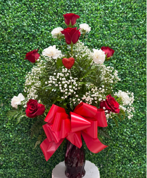 Crimson roses and soft carnations 