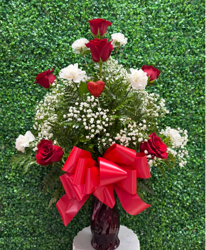 Crimson roses and soft carnations 