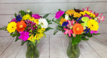 Splash of colour Hand tied assorted flowers in vase