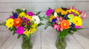 Splash of colour Hand tied assorted flowers in vase