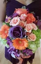 Dark purples with creamy oranges touch of green Handtied Bouquet