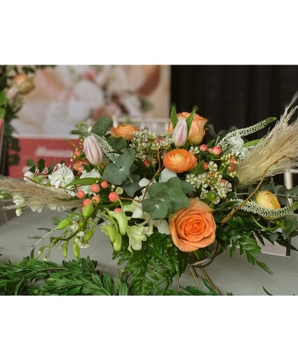 Designers choice elegant arrangement low and lush colorful arrangement