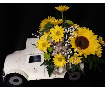 Down on the farm pick up truck with fresh fowers
