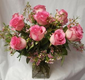 Dozen Beautiful Pink Roses arranged in a (R) RECTANGULAR VASE with seasonal filler...LOW arrangement all the way around !!! (16" to 18" tall)  Loved by many!!