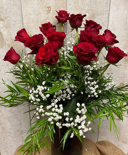 Dozen Red roses  in elegant glass vase