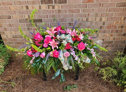Enchanting Peacock memories casket spray