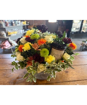 Fresh arrangement with a candle  