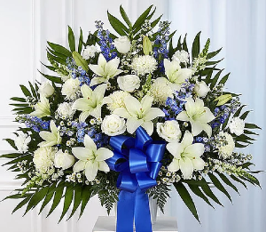 Funeral Basket: Blue and White Funeral Basket made with different types of flowers:Lilys, Roses, carnations, delphinium, etc.