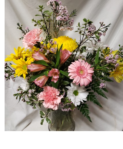 GARDEN LOOK ARRANGEMENT in a vase,  (S)    Mixture of seasonal flowers in stock.