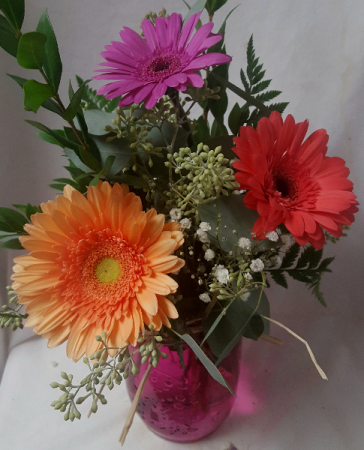 GERBERA BRIGHTS 3 GERBERA DAISY (E)  IN A MASON JAR. FLOWERS AND VASE COLOR MAY VARY