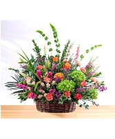 Gracious: Peach, Pink and Green Basket Arrangement